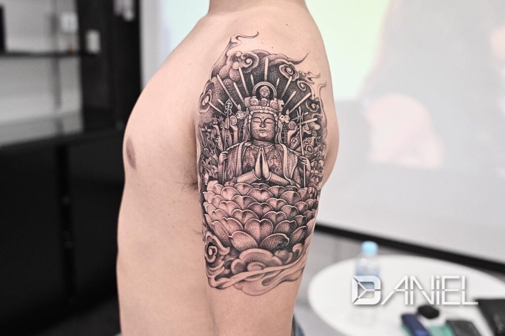 Buddhist statue tattoo Daniel