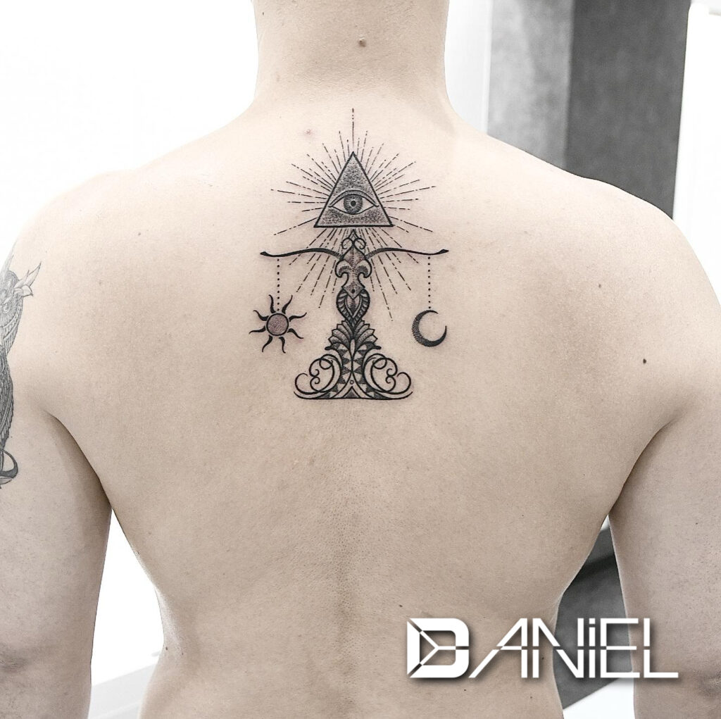 scales tattoo Daniel