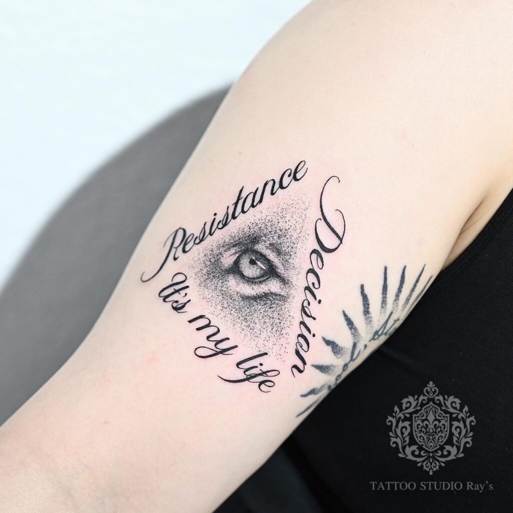 lion eye lettering tattoo AYUMI