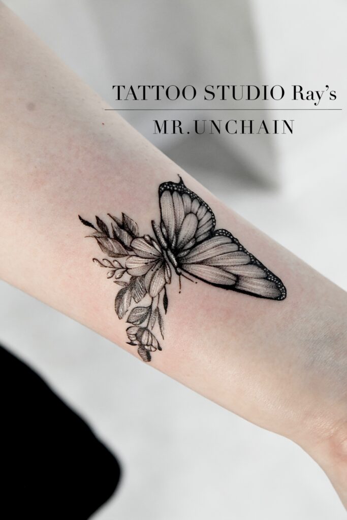 butterfly flower tattoo UC