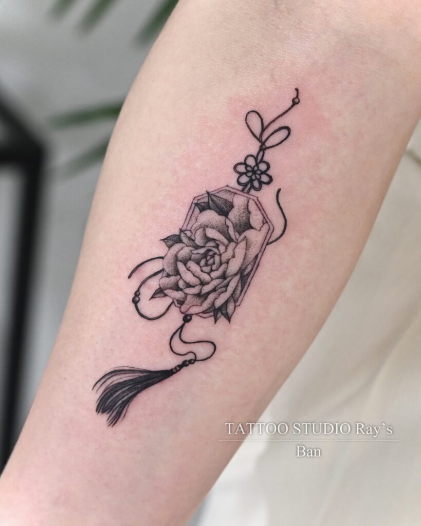 charm with peony tattoo ban