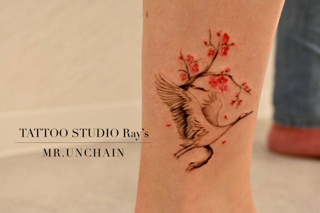 crane × cherry blossom tattoo uc