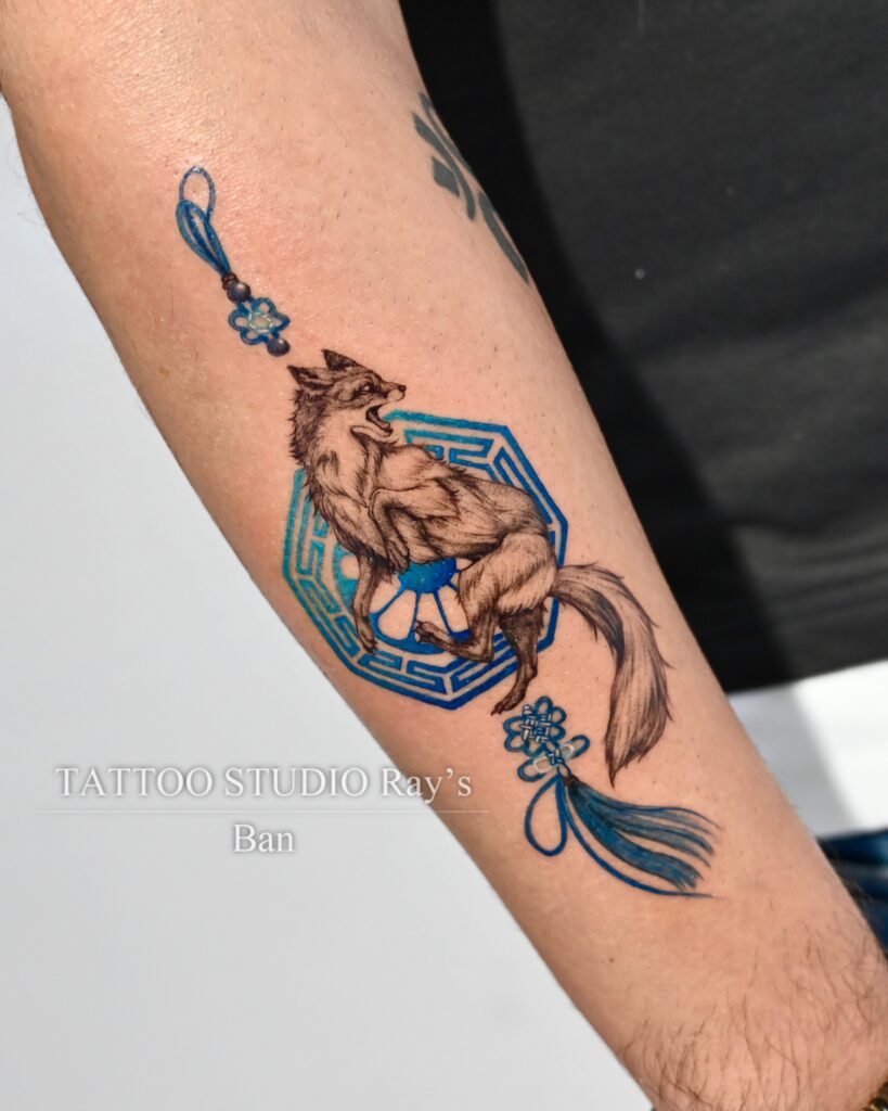 fox with blue charm tattoo ban