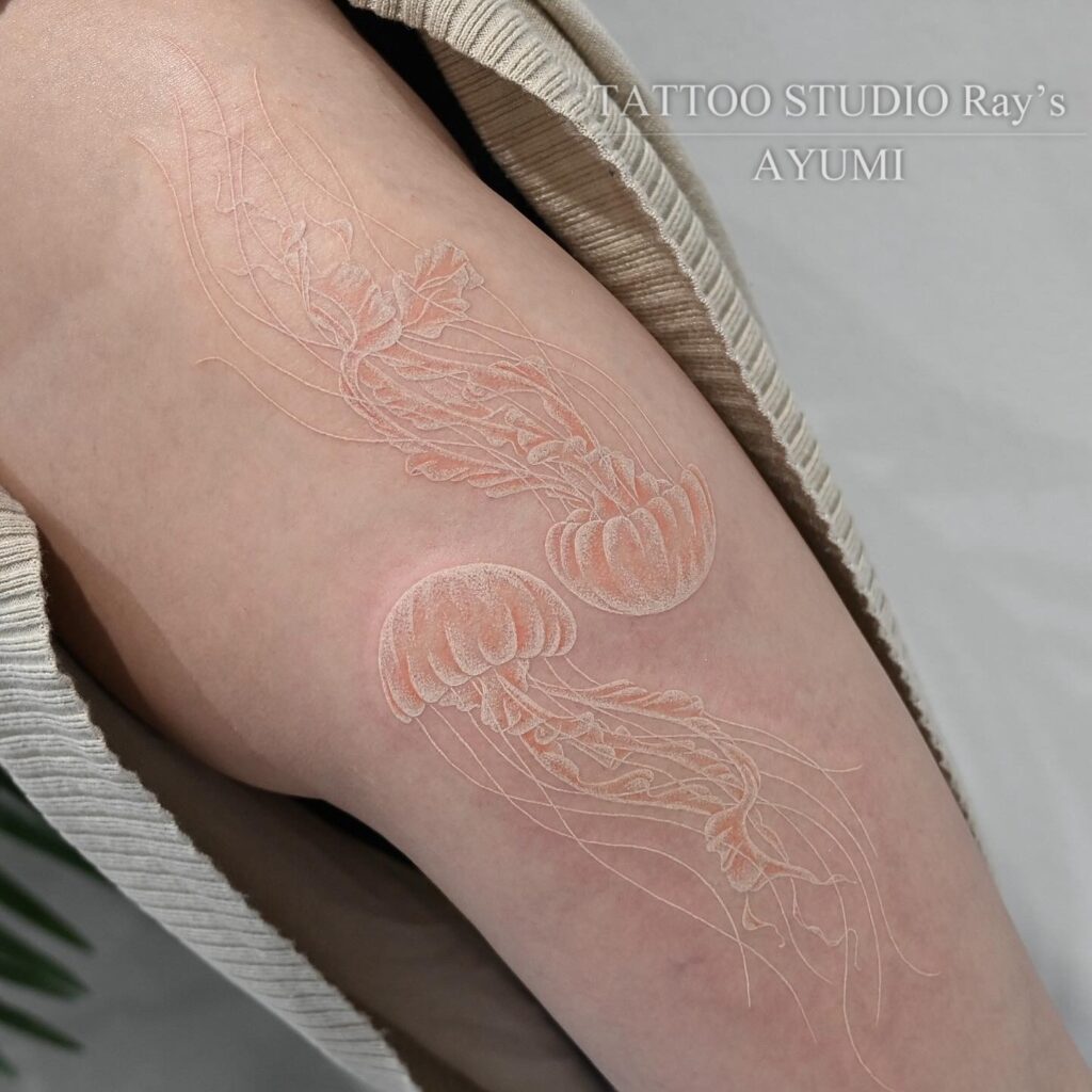 white & orange jellyfish tattoo ayumi