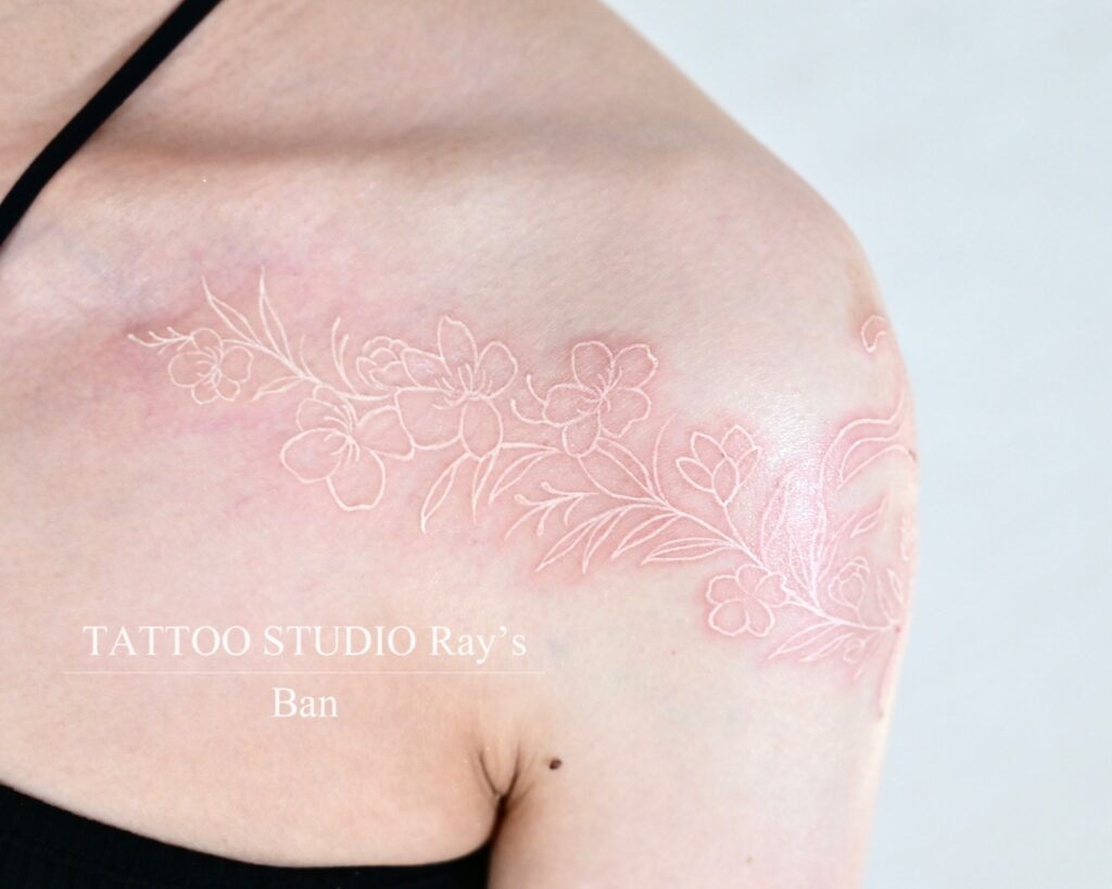 white flower × cat tattoo ban